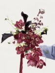 Bright burgundy cymbidium orchid cascade wedding bouquet with black calla lilies by Anelia Fleur Singapore